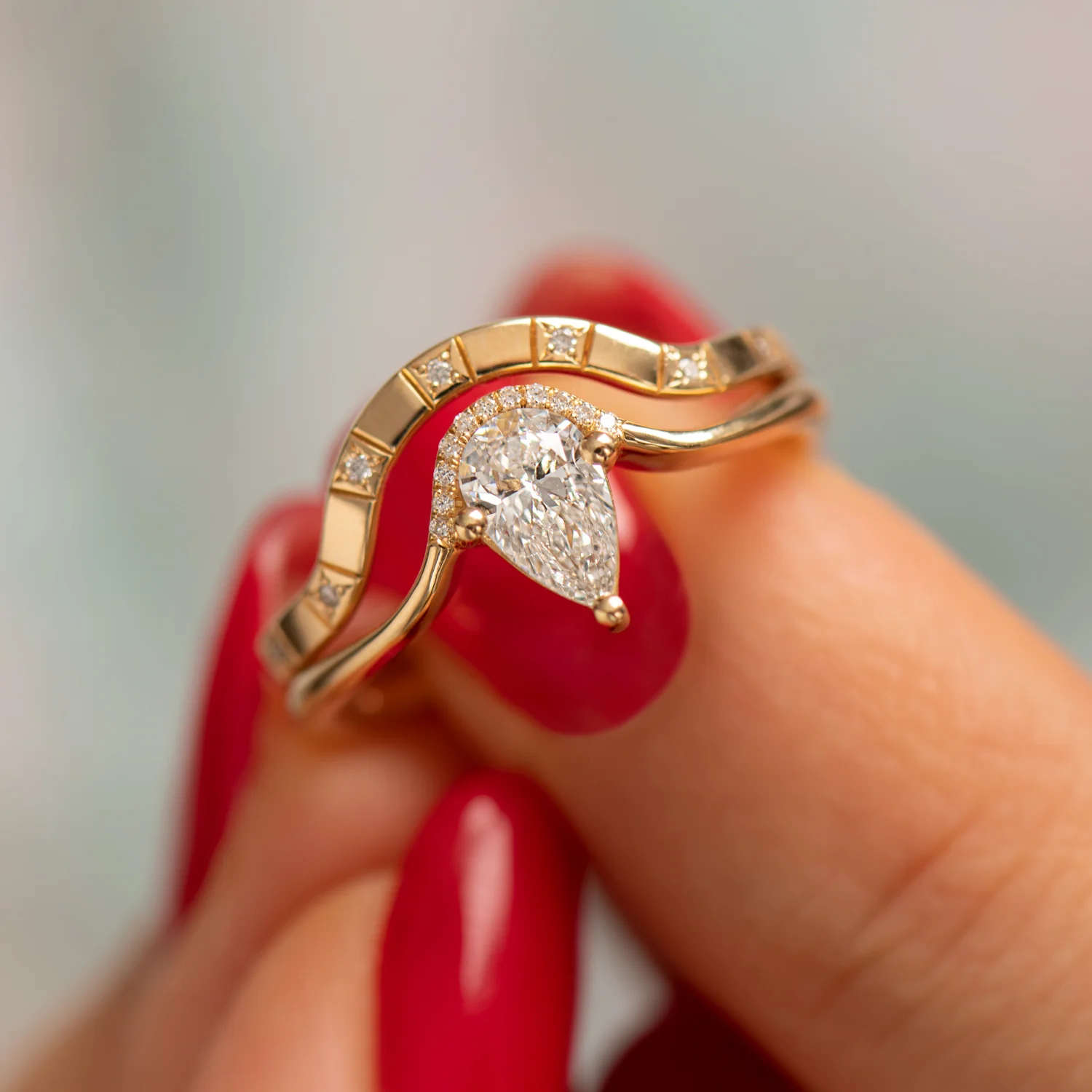 Floating Pear Cut Diamond Engagement Ring in a Classic Style - Image 3