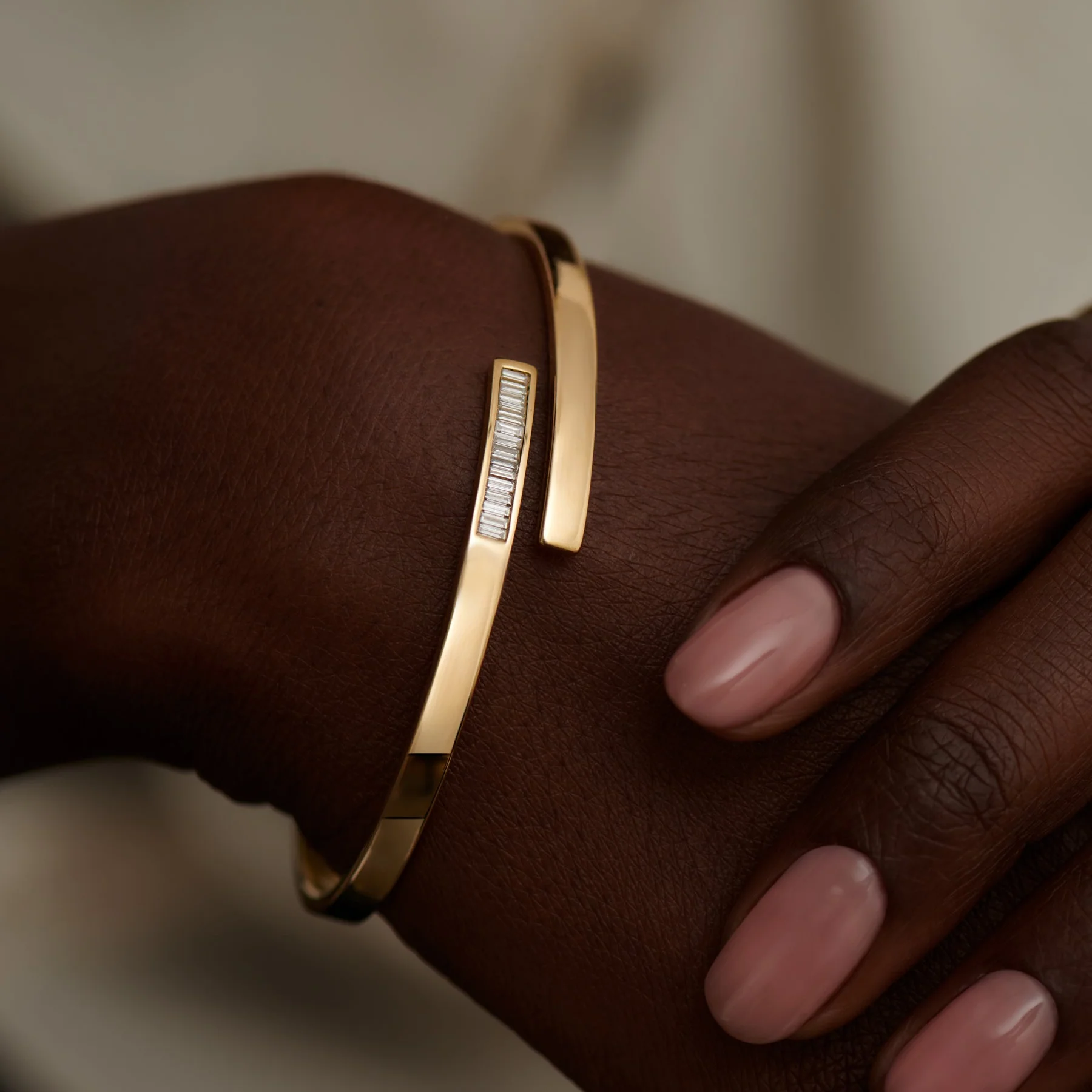 Golden Spiral Bangle with Inlaid Baguette Diamonds - Image 3