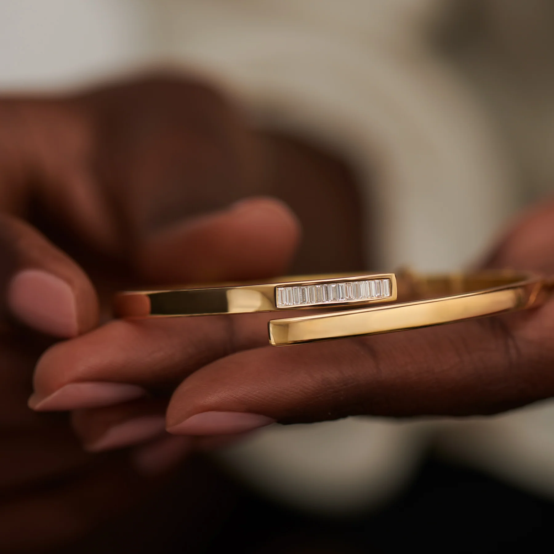 Golden Spiral Bangle with Inlaid Baguette Diamonds - Image 6