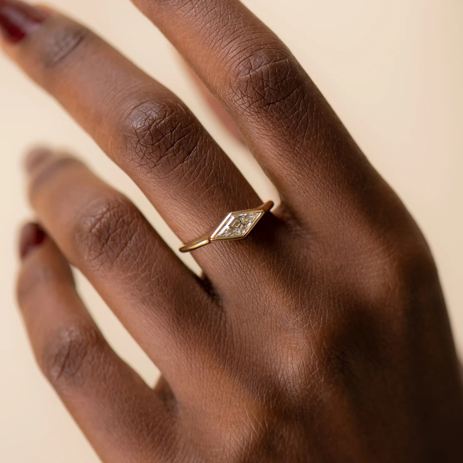 Lozenge Cut Diamond Engagement Ring with a Golden Bezel - Image 2