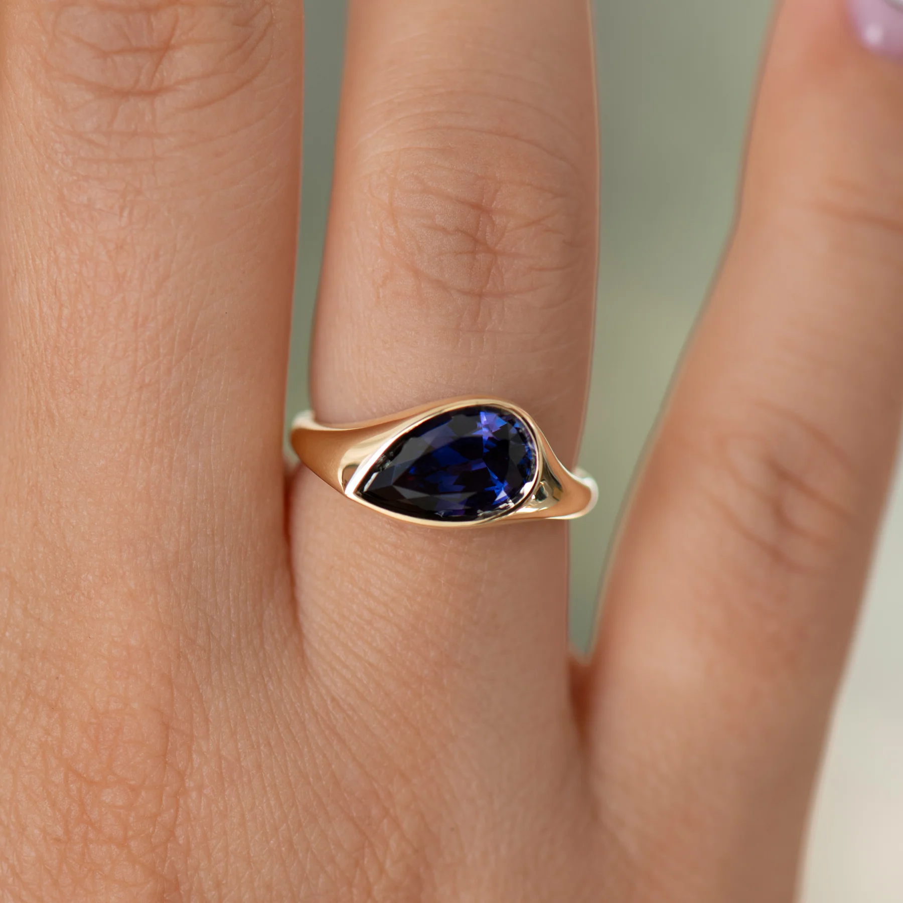 Pear Shape Sapphire Solitaire Ring in Violet Purple - Image 2