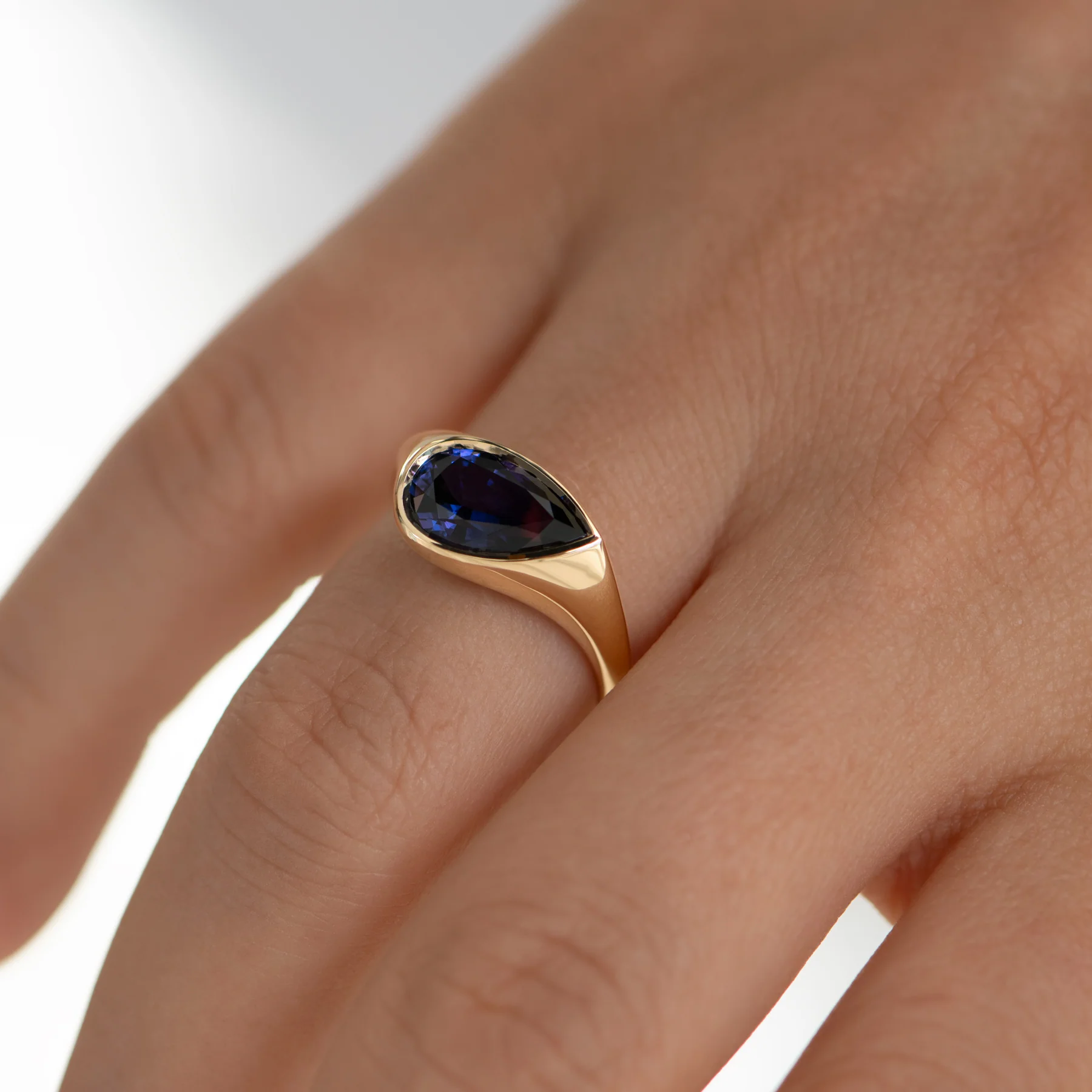 Pear Shape Sapphire Solitaire Ring in Violet Purple - Image 3