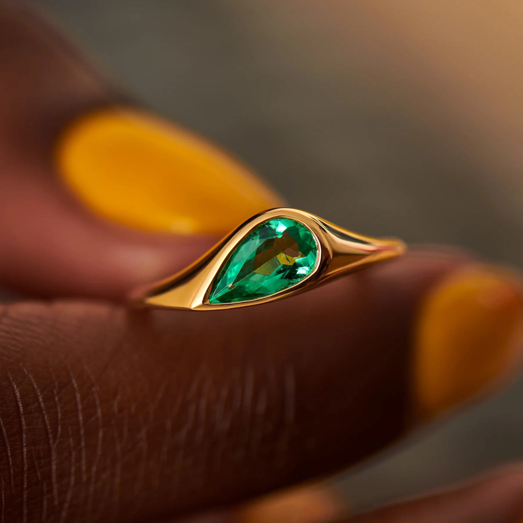 Solitaire Engagement Ring with a Pear Cut Emerald - Image 10
