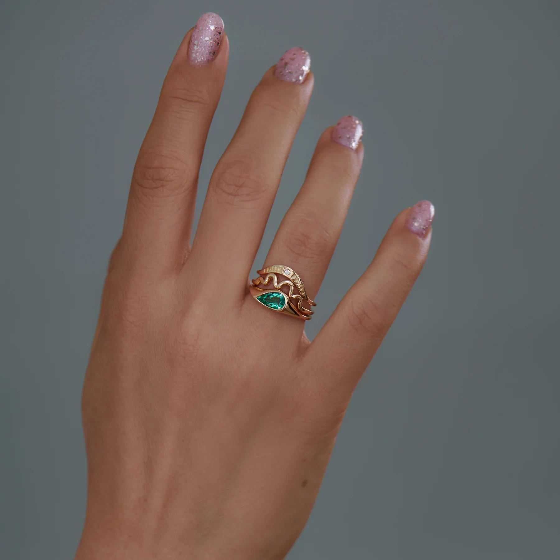 Solitaire Engagement Ring with a Pear Cut Emerald - Image 9